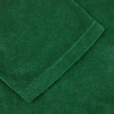 A close up image of a Grass Green Cotton Towelling Polo Shirt made by Fedeli.
