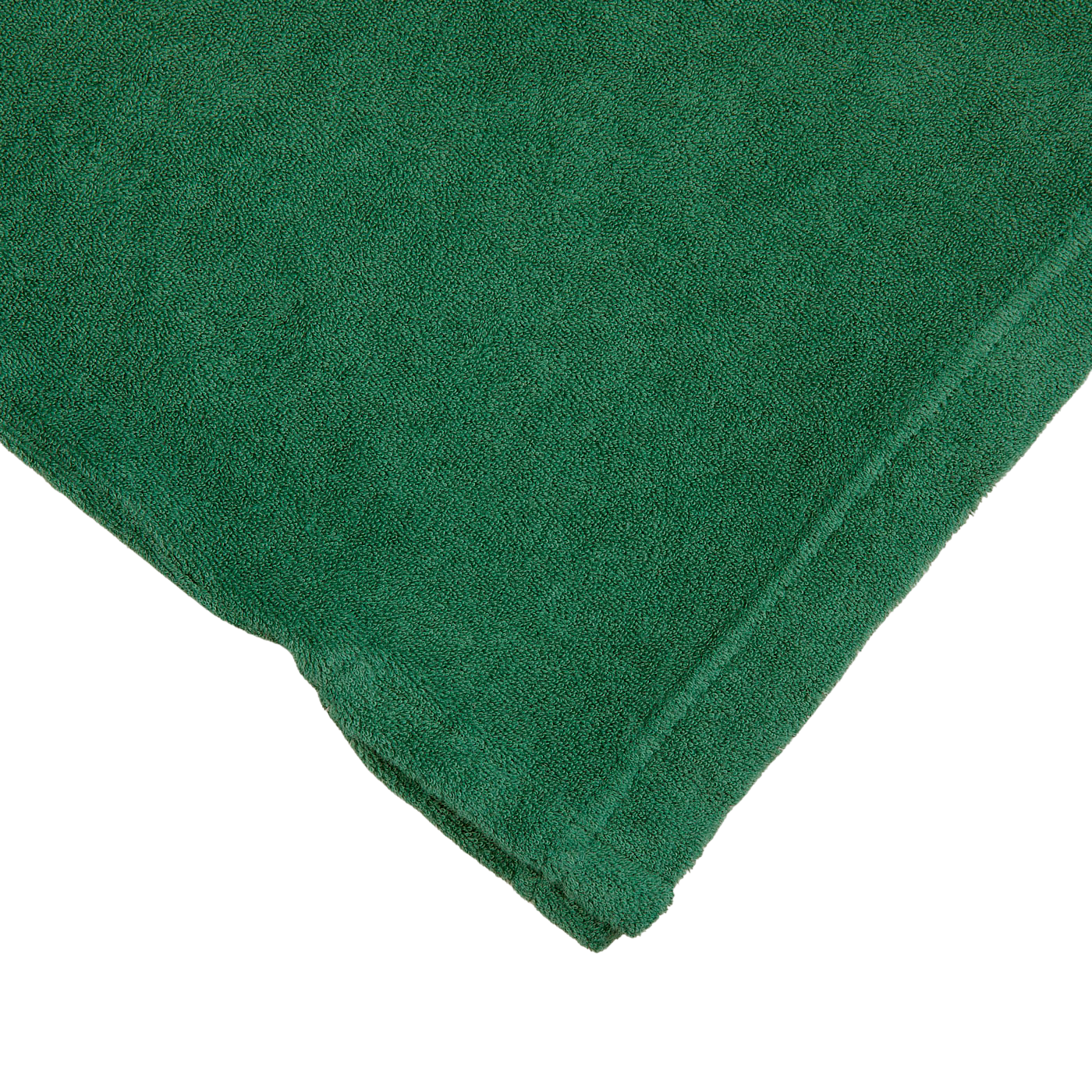 A Grass Green Cotton Towelling Polo Shirt folded on top of a white surface made of towelling cotton, by Fedeli.