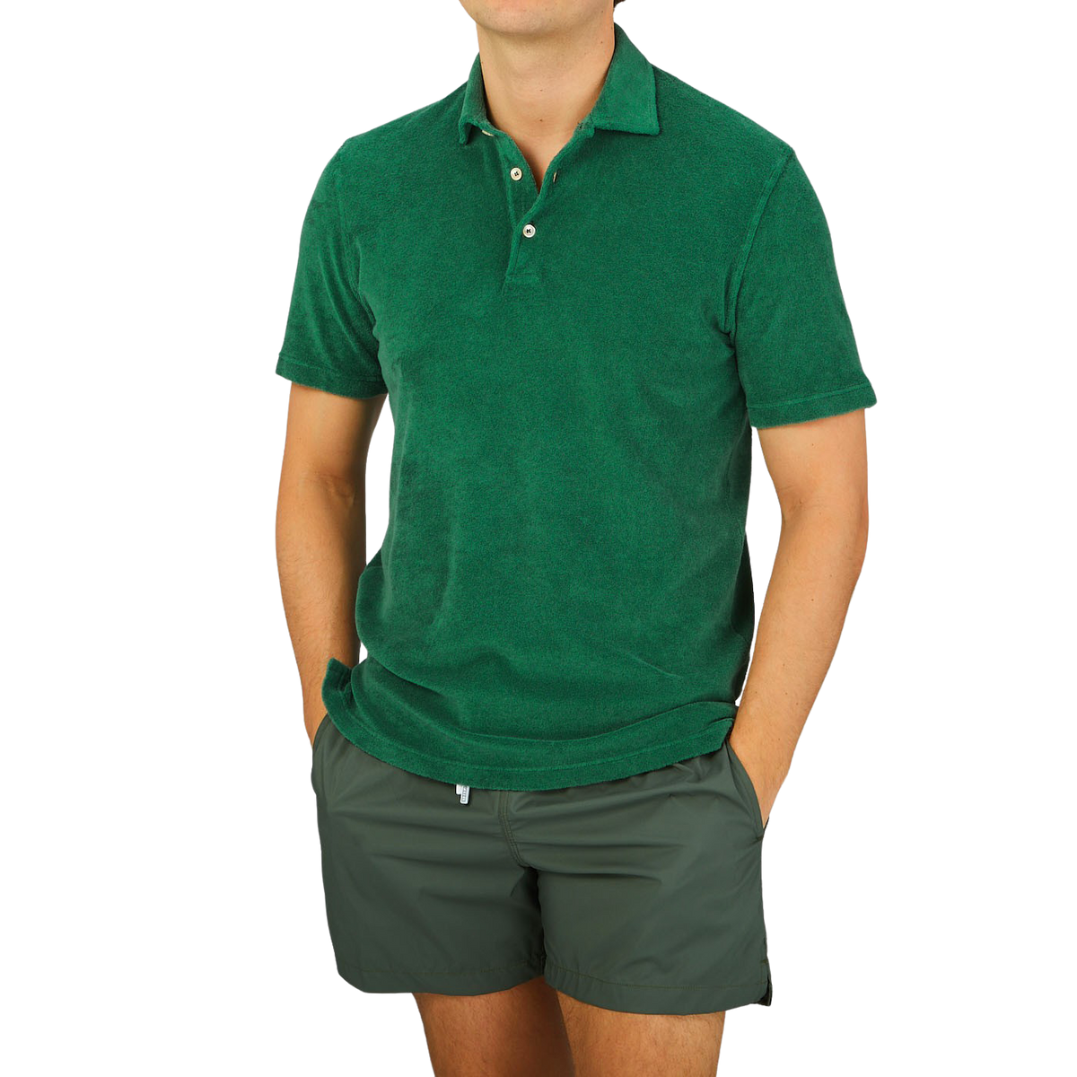 Baltzar, wearing a Fedeli Grass Green Cotton Towelling Polo Shirt and shorts.