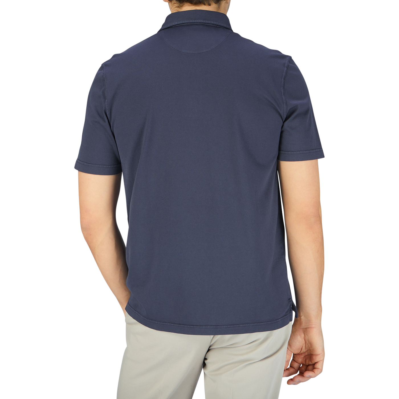 The back view of a man wearing a Fedeli Navy Blue Organic Cotton Polo Shirt.