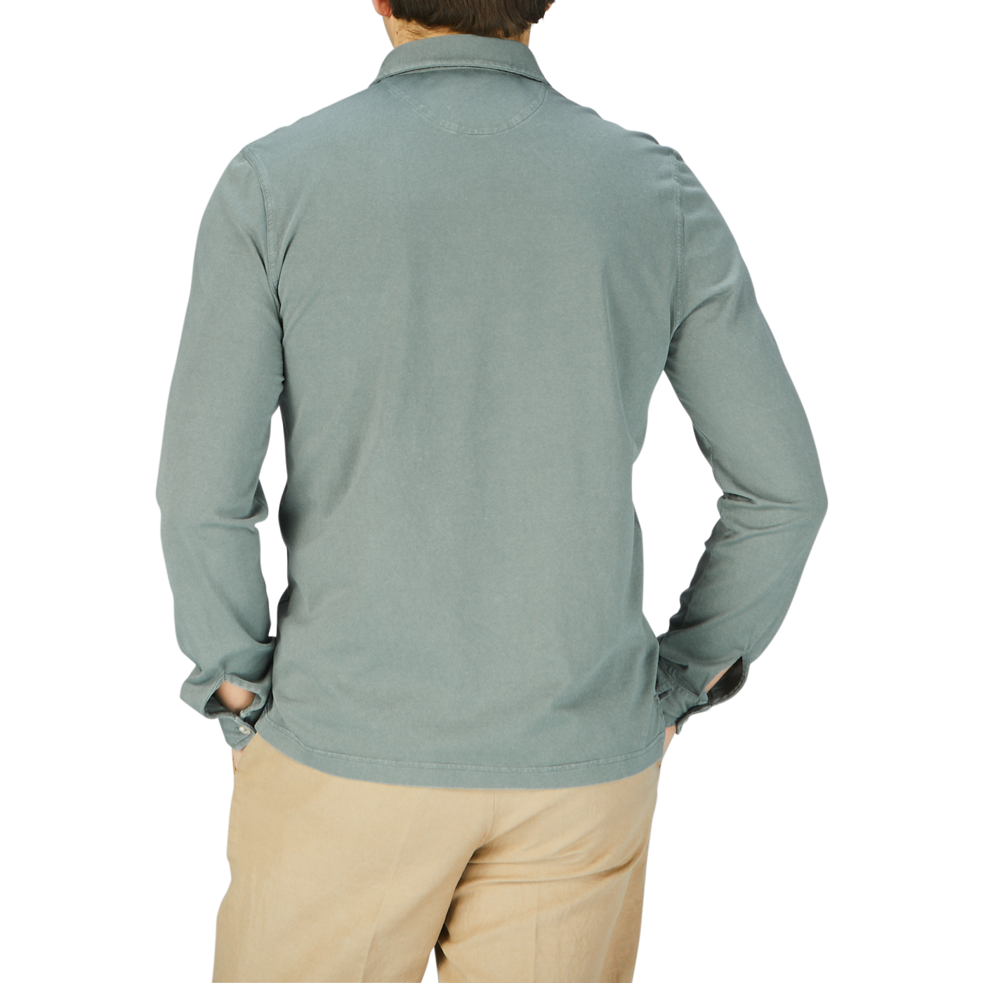 The back view of a man wearing a Fedeli Olive Green Organic Cotton LS Polo Shirt and khaki pants.