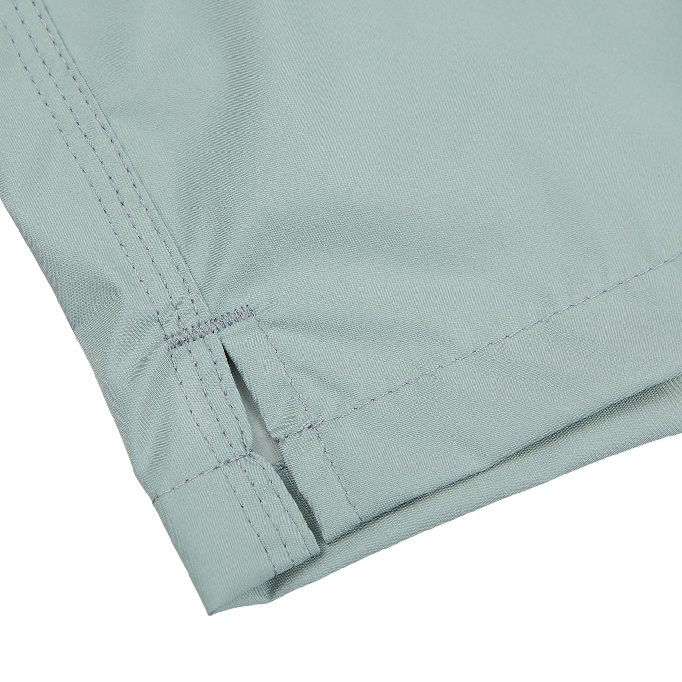 Close-up of Sage Green Madeira Microfiber Swim Shorts by Fedeli showing detailed stitching and a folded seam.