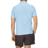 The back view of a man wearing a luxury Sky Blue Organic Cotton Polo Shirt by Fedeli.