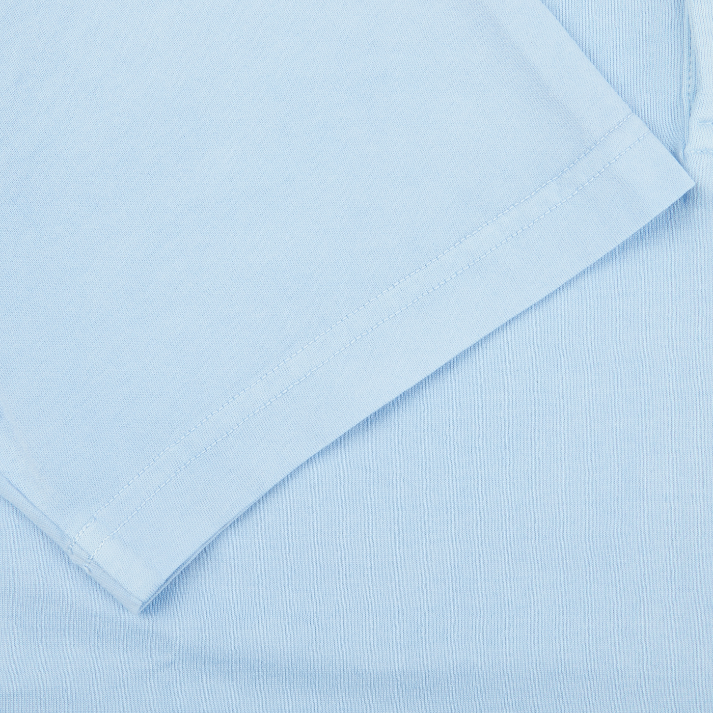A close up of a luxurious Sky Blue Organic Cotton polo shirt by Fedeli.