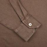 A close up of a Fedeli Washed Brown Organic Cotton LS Polo Shirt.