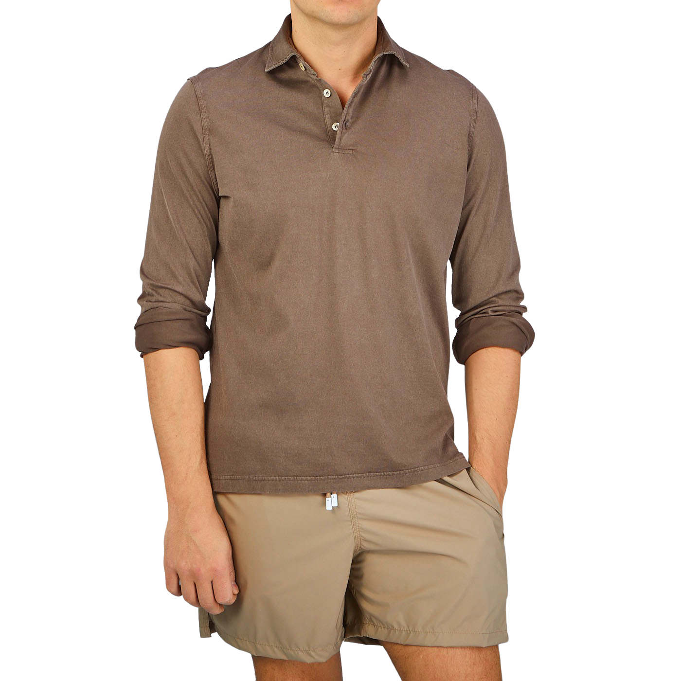 A man wearing a luxury Fedeli Washed Brown Organic Cotton LS Polo Shirt.