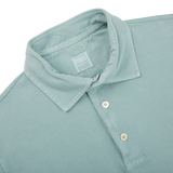 A close up of a Fedeli washed light green cotton pique polo shirt.