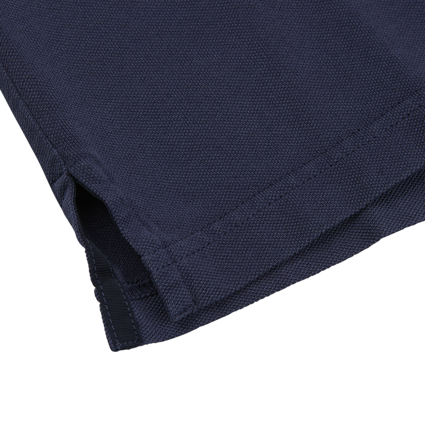 A close up of a Fedeli washed navy cotton pique polo shirt.