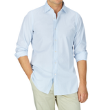 A man dressed in a Sky Blue Striped Cotton Seersucker Shirt and khaki pants by Finamore.