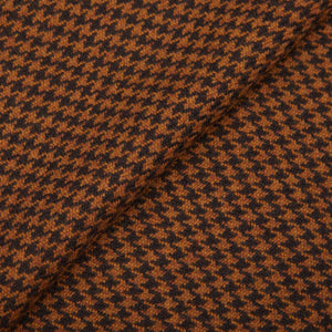 A close up of a Fox Brothers Chestnut Houndstooth Merino Wool Cashmere Scarf fabric.