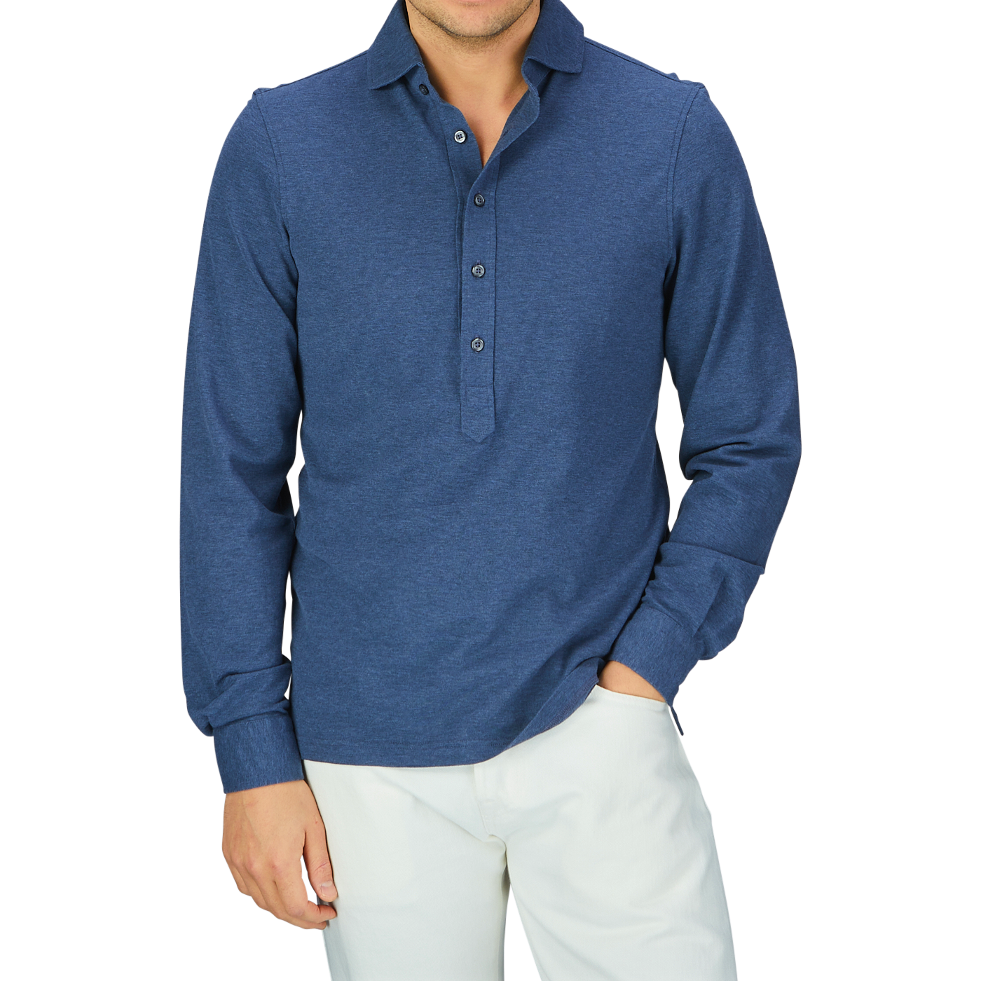 Man wearing a Gran Sasso blue cotton jersey popover shirt and white pants.