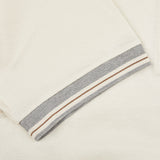 A close up of a Cream Beige Filo Scozia Zip Polo Shirt with a grey stripe by Gran Sasso.