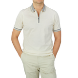 A man wearing a Gran Sasso Cream Beige Filo Scozia Zip Polo Shirt.