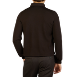 The man is wearing a dark Brown Merino Wool One-Piece Collar Polo Shirt, by Gran Sasso.