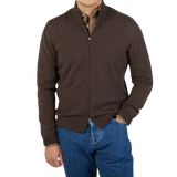 A contemporary man wearing a Gran Sasso Dark Brown Felted Cashmere Zip Cardigan and jeans.