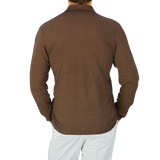 The back view of a man wearing a Gran Sasso Dark Brown Knitted Linen LS Polo Shirt.