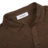 A Gran Sasso slim fit Dark Brown Knitted Linen LS Polo Shirt with a label on it.