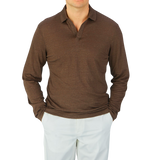 A man wearing a Gran Sasso Dark Brown Knitted Linen LS Polo Shirt.