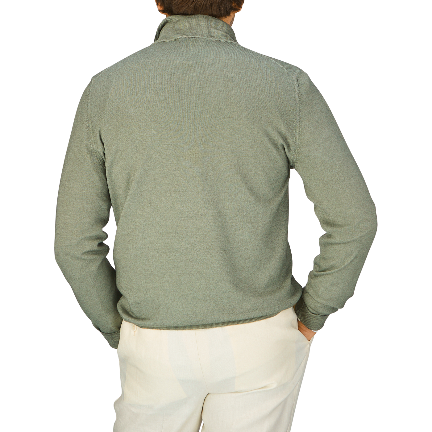 The back view of a man wearing a Gran Sasso Grass Green Vintage Merino Wool 1/4 Zip Sweater and white pants.