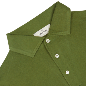Close-up of a green Gran Sasso Green Organic Cotton LS Polo Shirt showing detail of the collar and buttons.