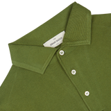 Close-up of a green Gran Sasso Green Organic Cotton LS Polo Shirt showing detail of the collar and buttons.