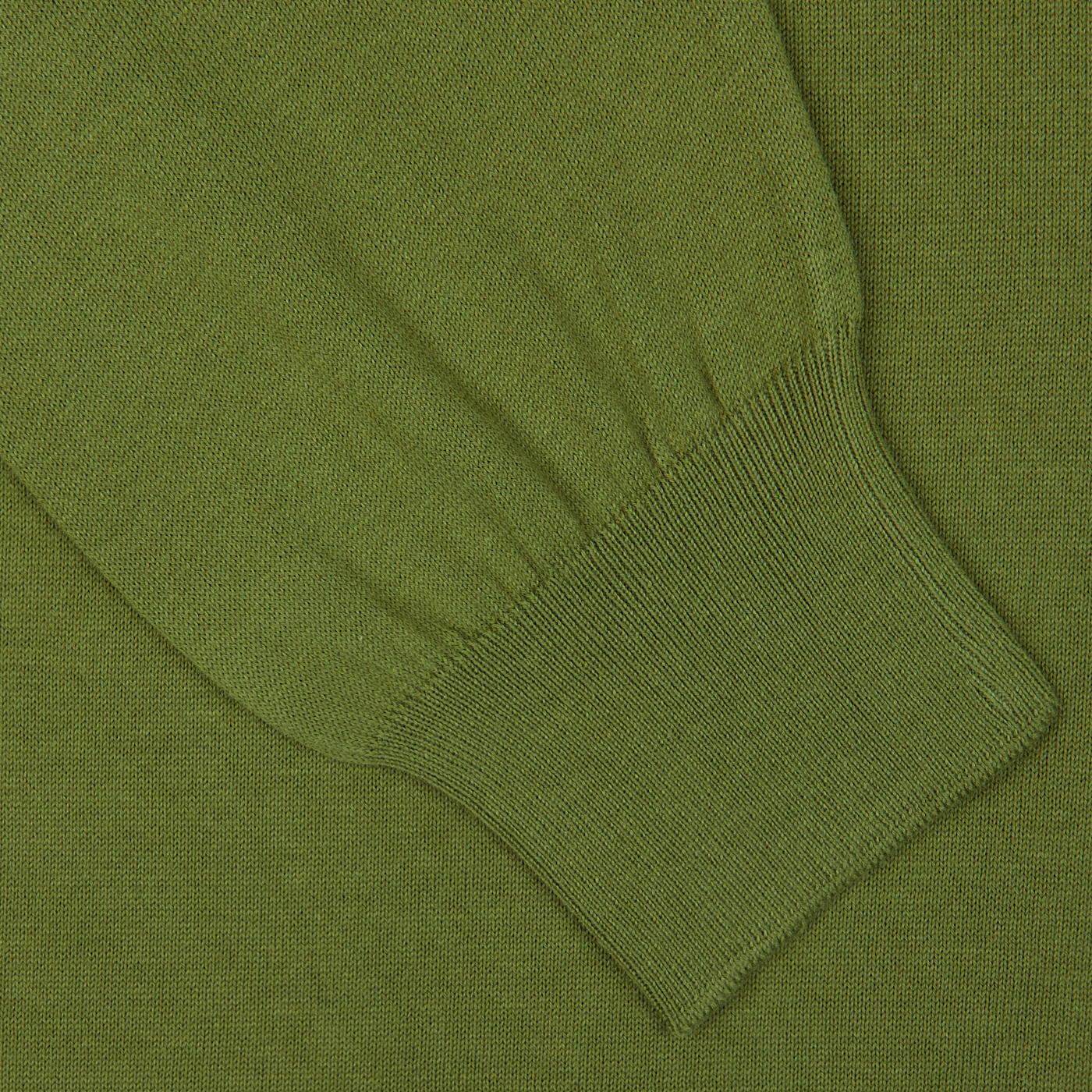 Close-up of a green Gran Sasso Green Organic Cotton LS Polo Shirt showing detailed texture and ribbed cuff pattern.
