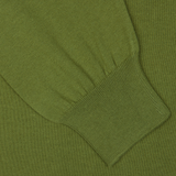 Close-up of a green Gran Sasso Green Organic Cotton LS Polo Shirt showing detailed texture and ribbed cuff pattern.