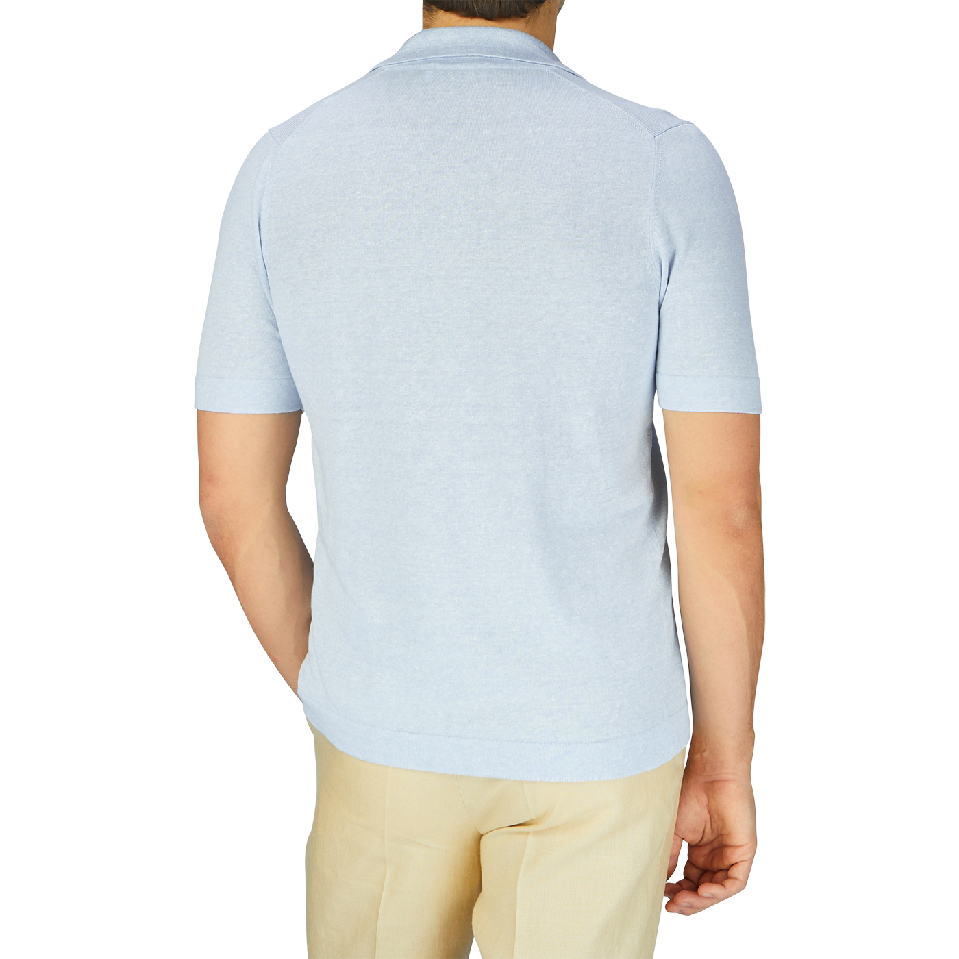 The back view of a man wearing a Gran Sasso Light Blue Linen Cotton Bowling Shirt and tan pants.
