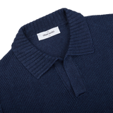 A close up of a Gran Sasso navy blue cotton linen polo shirt in a slim fit.