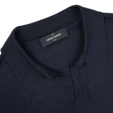 The collar of a navy Blue Knitted Silk Gran Sasso polo shirt.