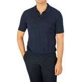 A man wearing a Gran Sasso Navy Blue Knitted Silk Polo Shirt.