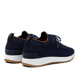 A pair of Gran Sasso navy blue technical knitted nylon trainers with white soles and brown accents.