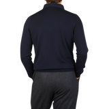 The back view of a man wearing a Gran Sasso Navy Merino Wool One-Piece Collar Polo Shirt.