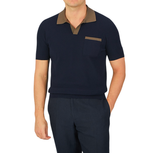 A man wearing a Navy Fresh Cotton Contrast Collar Polo Shirt by Gran Sasso and brown pants made of cotton.