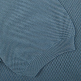 Close-up of a textured Turquoise Fresh Cotton Mesh Polo Shirt by Gran Sasso with detailed stitching.
