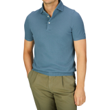 Man wearing a Turquoise Fresh Cotton Mesh Gran Sasso polo shirt and olive green trousers.