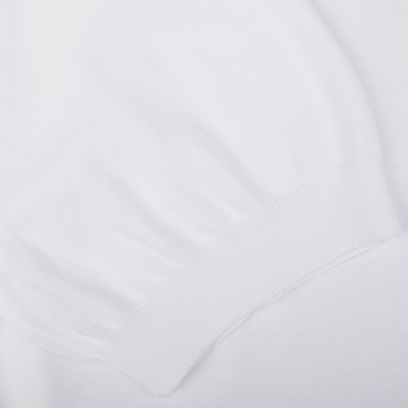 Close-up view of a white, ribbed fabric texture, likely a part of a Gran Sasso White Organic Cotton T-shirt.