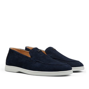 A pair of Dark Blue Suede Herno slip-on loafers with white soles.