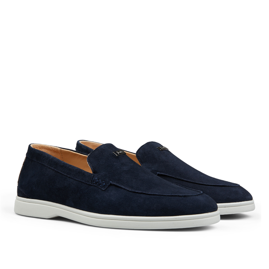A pair of Dark Blue Suede Herno slip-on loafers with white soles.