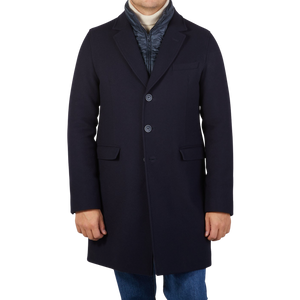 The man is wearing a Herno Navy Wool Down Padded Coat.