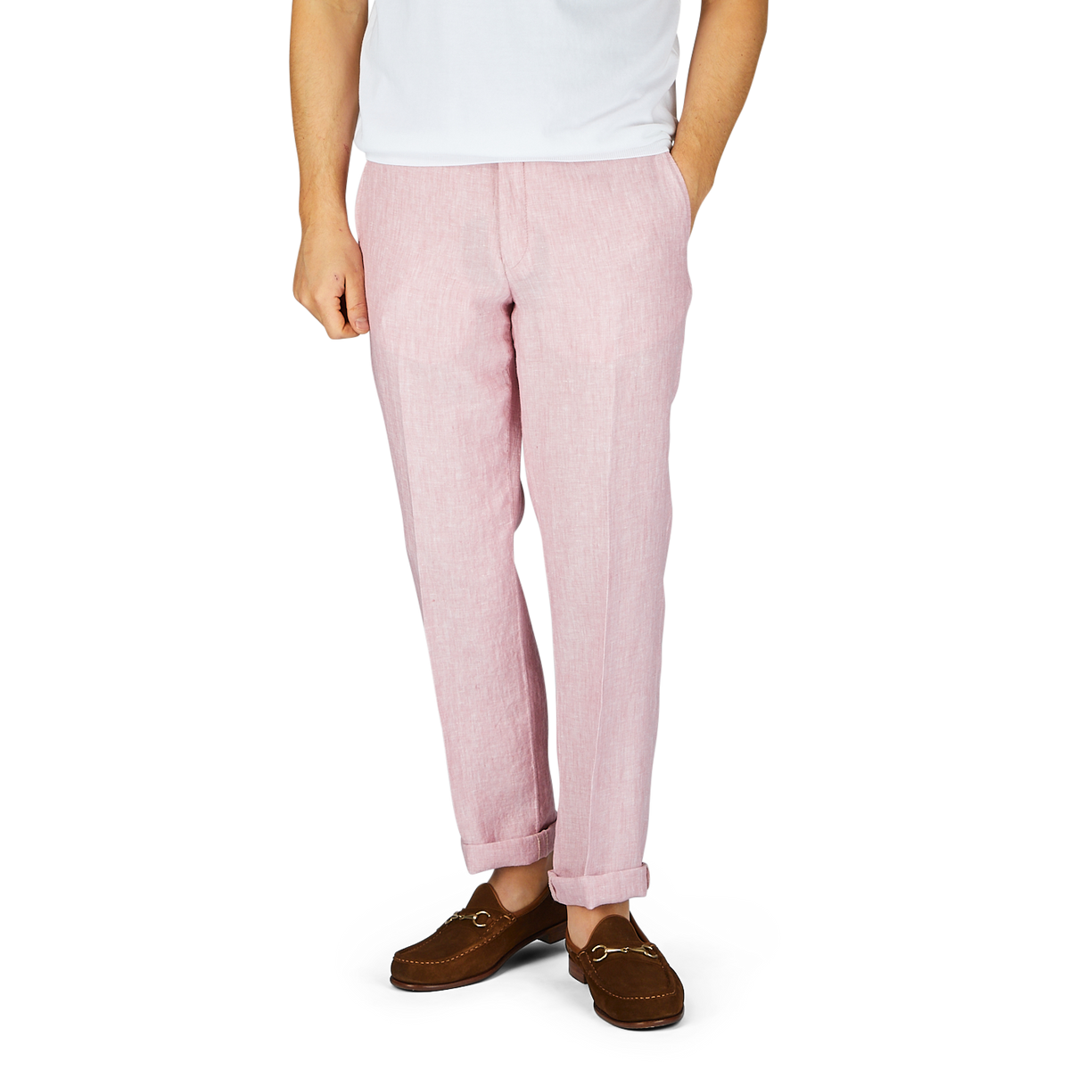 A person wearing Light Pink Washed Linen Regular Fit Chinos by Hiltl and brown loafers standing against a plain background.