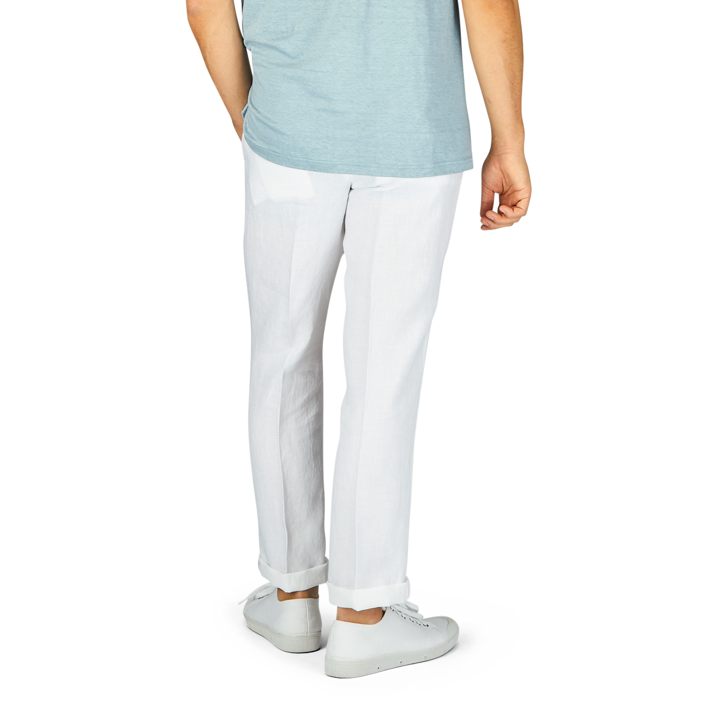 Man standing in a light blue t-shirt and Hiltl White Washed Linen Regular Fit Chinos with white sneakers, partial view showing from waist down.
