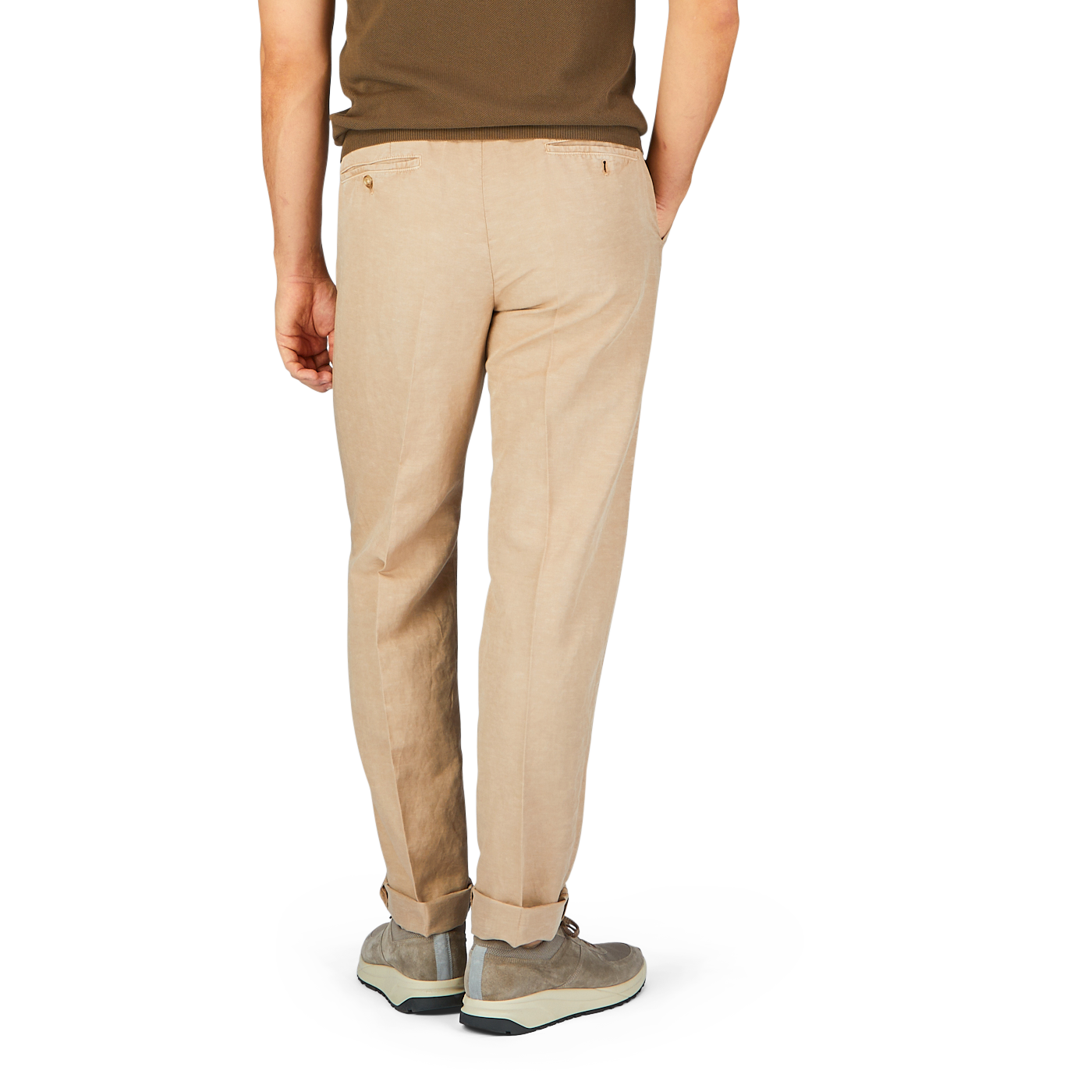 A person standing facing away from the camera, wearing Light Beige Chinolino Straight Fit Trousers by Incotex and grey shoes.