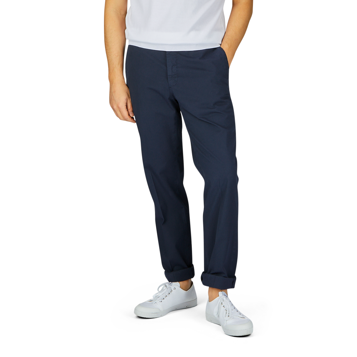 A person standing against a white background, wearing Incotex navy blue cotton stretch regular fit chinos and white sneakers.