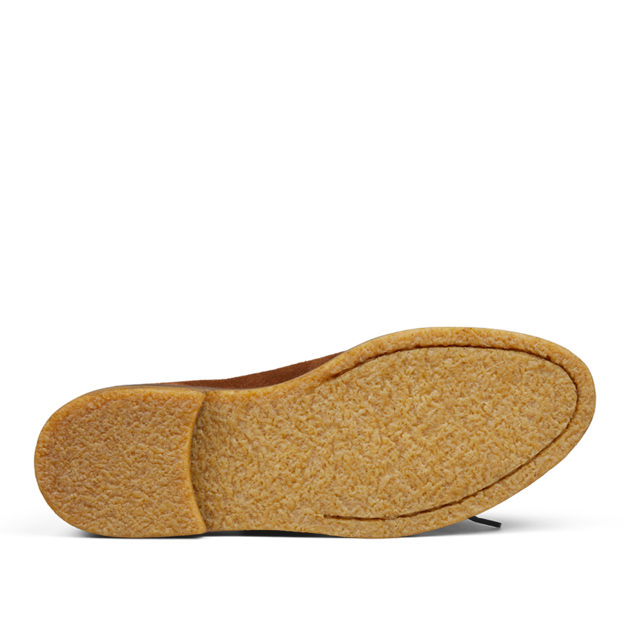 A pair of Tobacco Brown Suede Leather Edouard Derbies by Jacques Soloviére Paris with soft, fuzzy exteriors and comfortable rubber soles isolated on a white background.