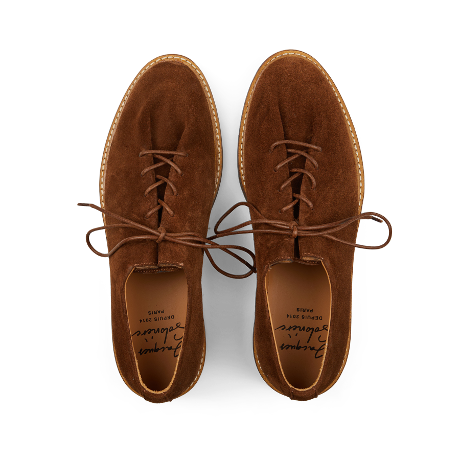 A pair of timeless tobacco brown suede leather Edouard Derbies with laces, viewed from above by Jacques Soloviére Paris.