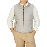 A man wearing a Manto Beige Reversible Loro Piana Cashpima Gilet and khaki pants.