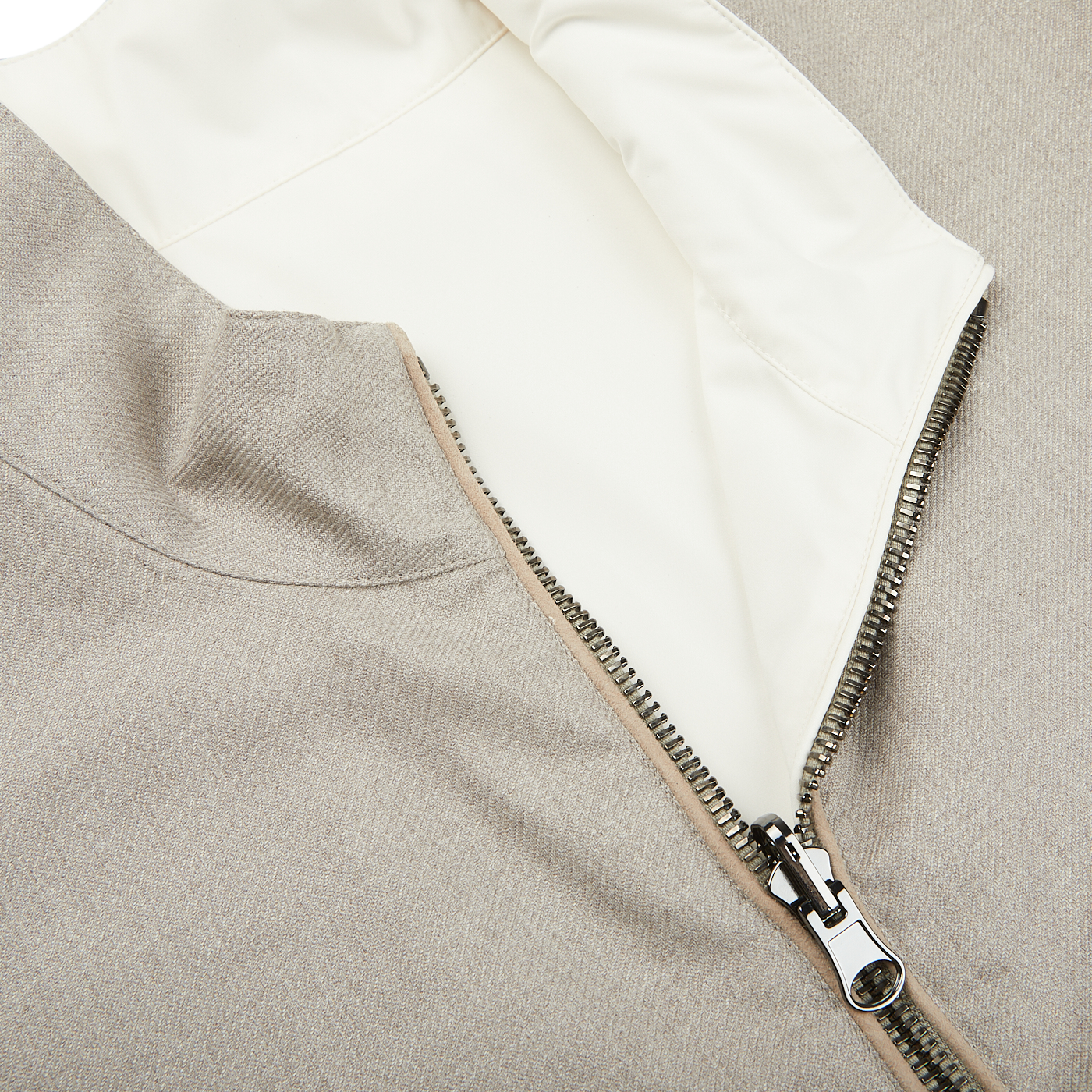A weather-resistant Manto beige jacket with a zipper.