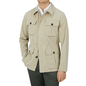 A man wearing a Manto Khaki Beige Ultrafine Microfiber Safari Jacket, which is wind and water-resistant.