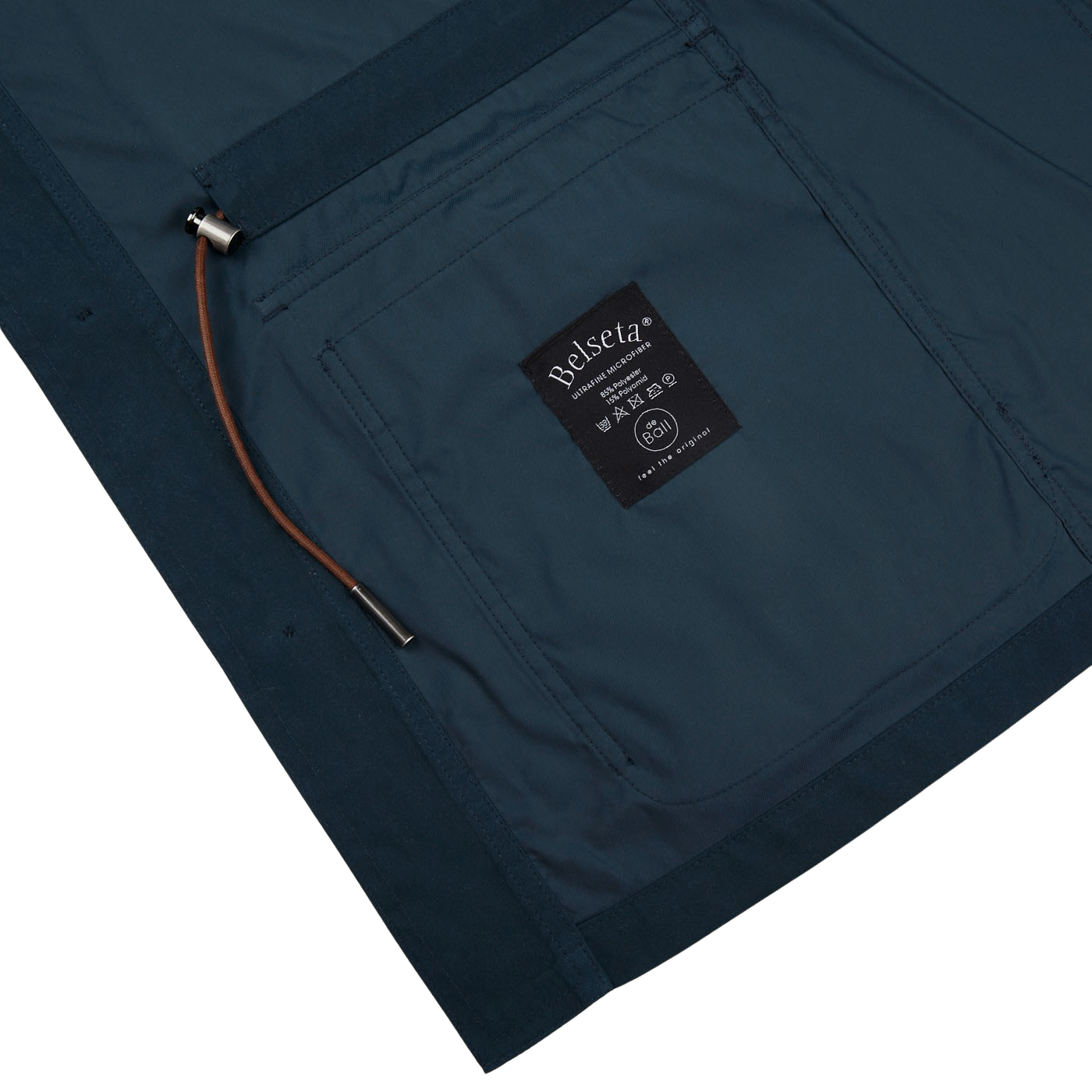 The water-resistant pocket of a Navy Blue Ultrafine Microfiber Safari Jacket by Manto with a logo on it.